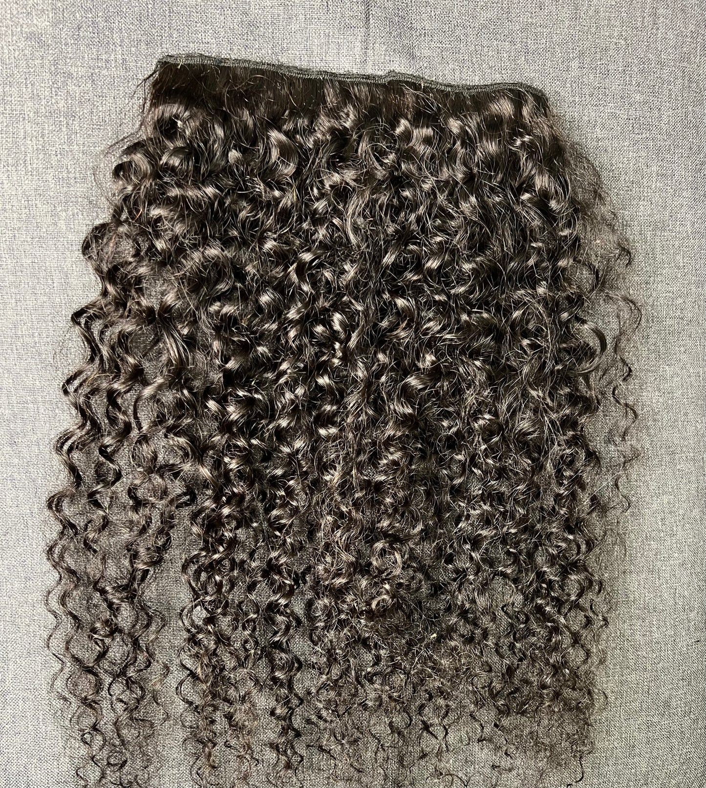 Lockige Clip-in-Extensions
